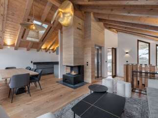 Experience luxury living in this stunning property featuring a cozy fireplace, perfect for chilly evenings.