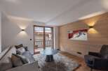 Experience luxury living in this stunning property, featuring a cozy living room with a modern design.