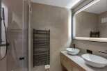 This modern bathroom features a sleek design with a minimalist aesthetic.