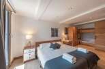 This cozy bedroom features a comfortable bed with soft linens and a stylish design.