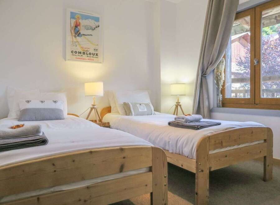This charming bedroom features two cozy twin beds, perfect for a comfortable stay.