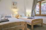 This charming bedroom features two cozy twin beds, perfect for a comfortable stay.