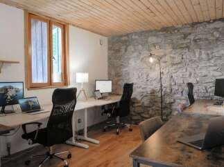 Discover the perfect blend of rustic charm and modern functionality in this stunning office space.
