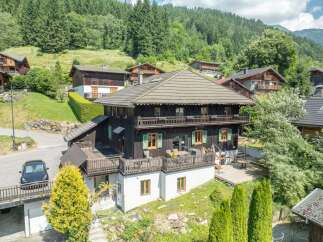 Discover the charm of this stunning chalet nestled in a picturesque mountain setting.