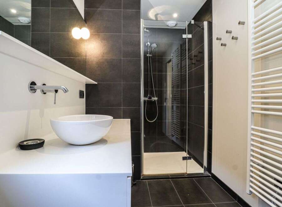 Step into modern luxury with this stunning bathroom.