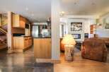 This stunning property boasts a modern kitchen with sleek cabinetry and stainless steel appliances, perfect for culinary enthusiasts.