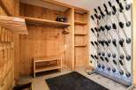 This ski storage room offers a blend of functionality and rustic charm, perfect for organizing your gear.