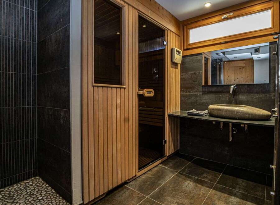 Step into luxury with this stunning bathroom featuring a sauna.
