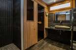 Step into luxury with this stunning bathroom featuring a sauna.