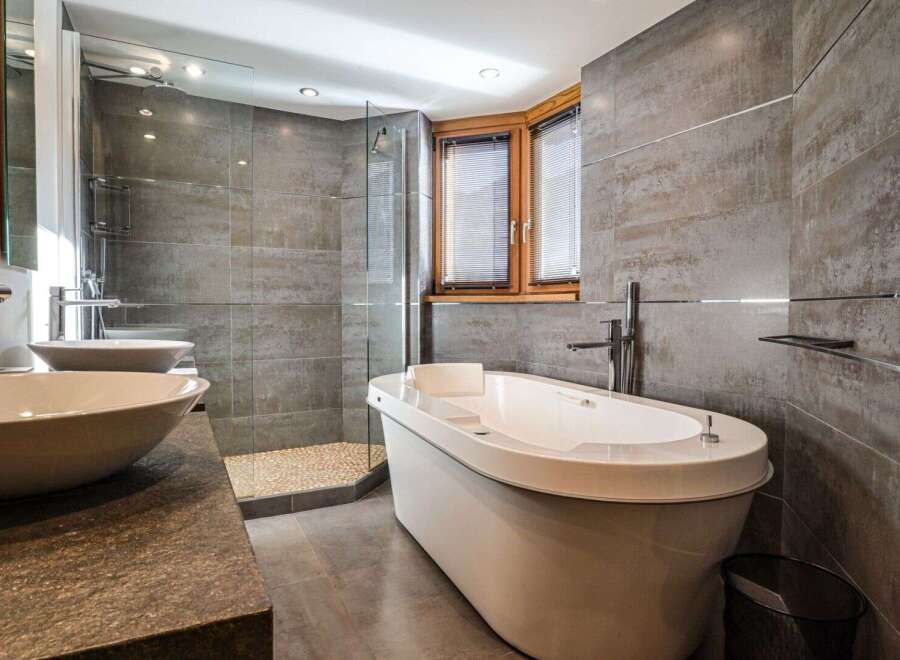 Indulge in luxury within this stunning bathroom, featuring a sleek, modern design.