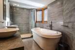 Indulge in luxury within this stunning bathroom, featuring a sleek, modern design.