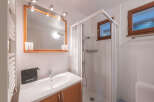 This charming bathroom features a bright and airy design, perfect for starting your day.