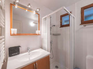 This charming bathroom features a bright and airy design, perfect for starting your day.