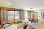 Experience modern mountain living in this beautifully appointed apartment, featuring a spacious open-plan living and dining area perfect for entertaining.