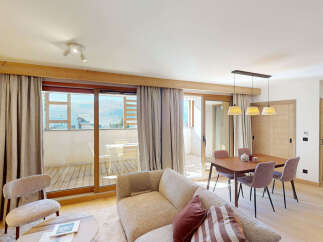 Experience modern mountain living in this beautifully appointed apartment, featuring a spacious open-plan living and dining area perfect for entertaining.