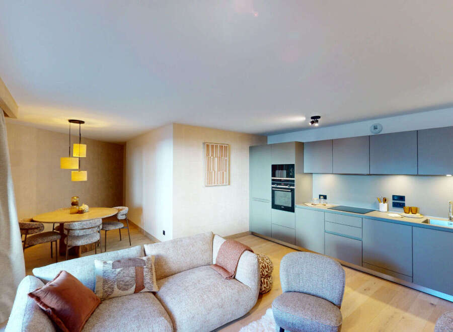 Experience modern living in this beautifully appointed apartment, featuring a sleek, integrated kitchen with state-of-the-art appliances and ample counter space.