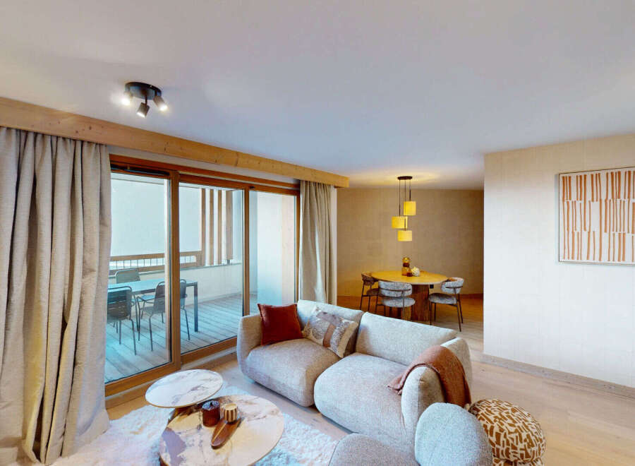 Experience modern living in this spacious apartment, featuring a comfortable living area with plush seating and a stylish dining space perfect for entertaining.