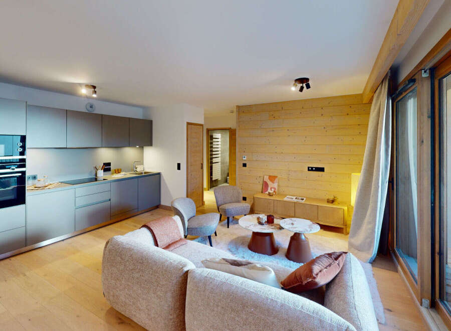 Experience modern alpine living in this beautifully appointed apartment, featuring a sleek, integrated kitchen with state-of-the-art appliances.