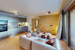 Experience modern alpine living in this beautifully appointed apartment, featuring a sleek, integrated kitchen with state-of-the-art appliances.
