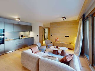 Experience modern alpine living in this beautifully appointed apartment, featuring a sleek, integrated kitchen with state-of-the-art appliances.