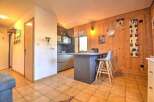 Discover this charming property featuring a cozy kitchen with a breakfast bar, perfect for casual dining.