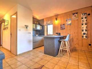 Discover this charming property featuring a cozy kitchen with a breakfast bar, perfect for casual dining.