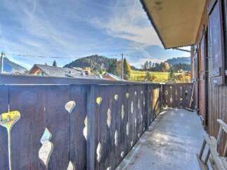 Enjoy breathtaking mountain views from this charming balcony.