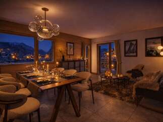 Experience the epitome of luxury living in this stunning property, featuring a beautifully designed dining area perfect for intimate gatherings.