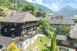 Nestled in a picturesque mountain village, this charming wooden chalet offers breathtaking views and a serene escape.