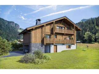 This stunning chalet-style home offers a perfect blend of rustic charm and modern comfort.