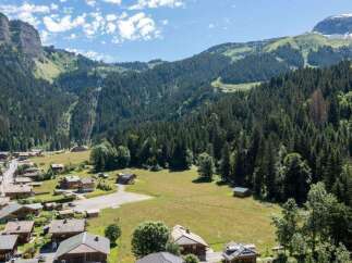 Nestled in a picturesque mountain valley, this charming property offers stunning views and a tranquil escape.