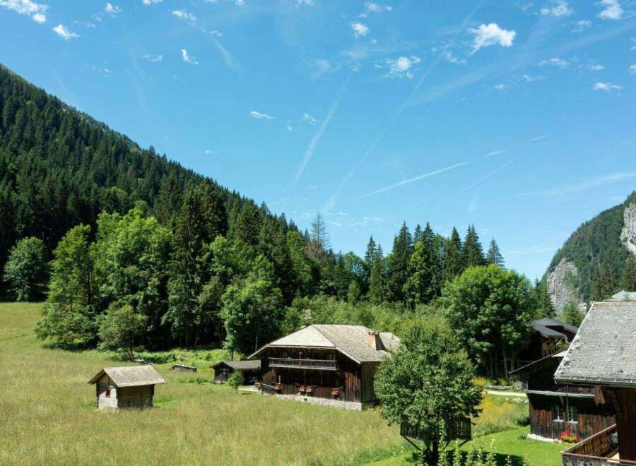Nestled in a picturesque mountain setting, this charming property offers a tranquil escape.