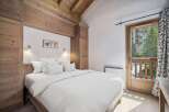 Experience the charm of this cozy bedroom, featuring a comfortable bed and a serene ambiance.