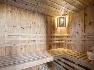 Step into relaxation with this stunning sauna.