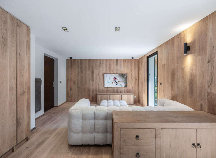 This stunning living room showcases a modern design with a warm, inviting ambiance.