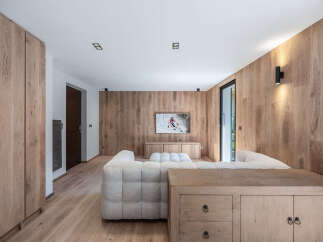 This stunning living room showcases a modern design with a warm, inviting ambiance.