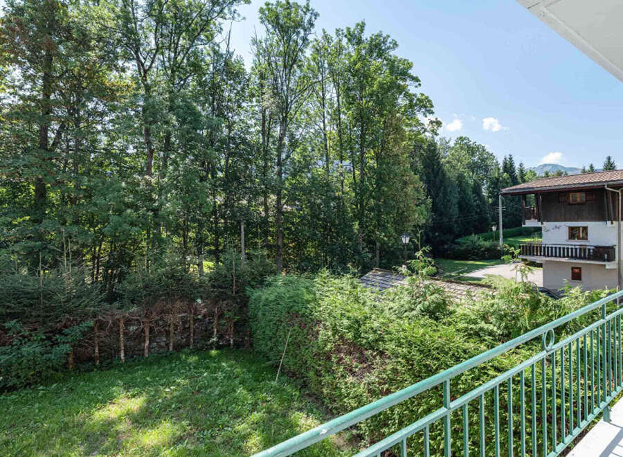 Enjoy breathtaking views from this charming property, surrounded by lush greenery and mature trees.