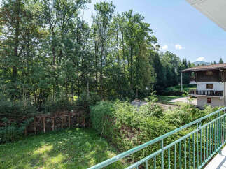Enjoy breathtaking views from this charming property, surrounded by lush greenery and mature trees.