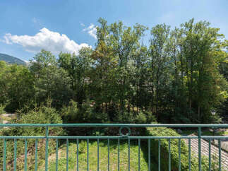 Enjoy breathtaking views from this stunning property! This home boasts a beautiful outdoor space with lush greenery and a serene atmosphere.