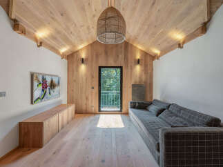 This stunning living space showcases a modern design with a touch of rustic charm.