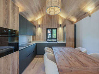 This stunning kitchen boasts a modern design with a rustic touch, perfect for any home.
