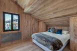 Experience the charm of this stunning bedroom, featuring exquisite wooden accents throughout.