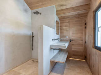 Step into a world of serene luxury with this stunning bathroom design.