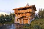 Discover the charm of this stunning wooden chalet nestled in a picturesque mountain setting.