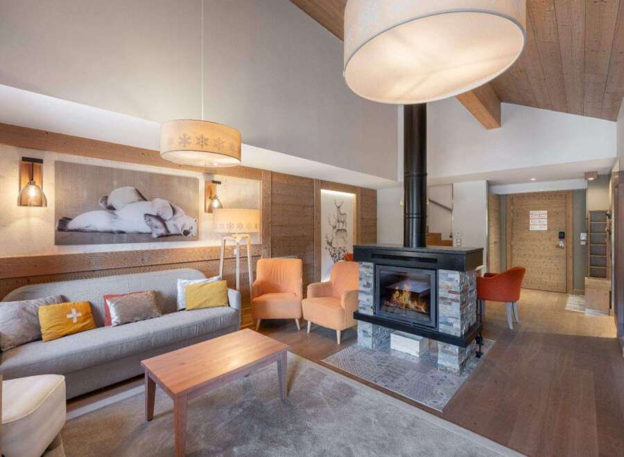 Experience luxury living in this stunning property, featuring a cozy fireplace and elegant design.