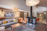 Experience luxury living in this stunning property, featuring a cozy fireplace and elegant design.