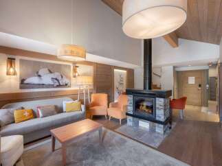 Experience luxury living in this stunning property, featuring a cozy fireplace and elegant design.
