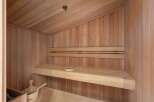Step into relaxation with this stunning sauna, a perfect addition to any luxury home.