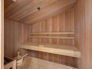 Step into relaxation with this stunning sauna, a perfect addition to any luxury home.