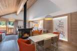 Experience the warmth of this stunning property, featuring a cozy fireplace and a stylish dining area.